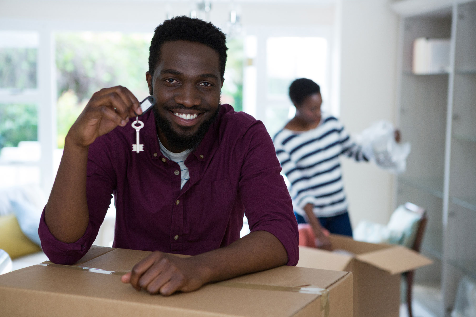 A man holding a keys to new home